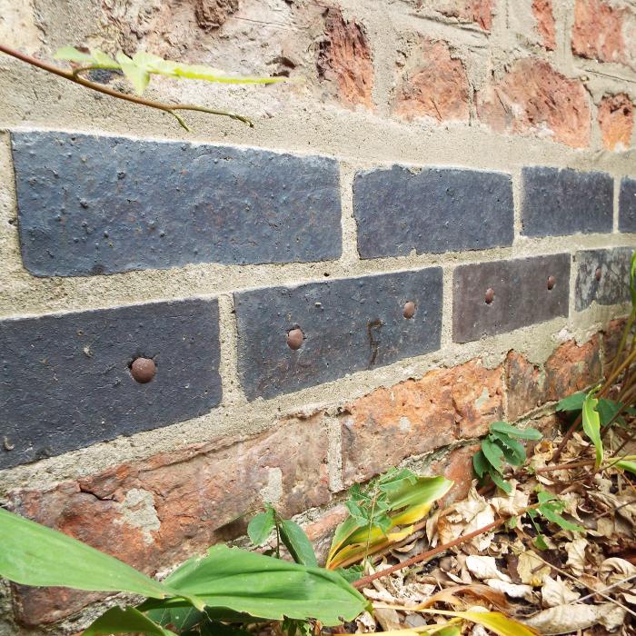 How many damp proof courses does one building need?.........
3 Retrofit damp proof courses, 1 blue brick and 2 x chemcial injections. Clearly some misdiagnosis here!