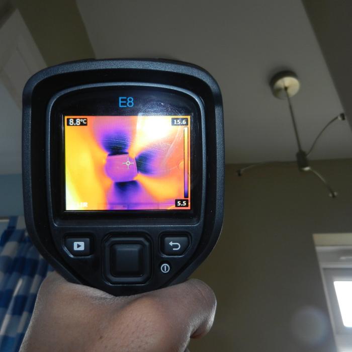 This is a thermal image taken of a Positive Input Ventilation (PIV) system installed into the first floor landing ceiling of a property which had previously been suffering with issues of condensation. &nbsp;The Positive Input Ventilation system is designed to filter air from the loft space of the building into the property through a diffuser and G4 filter which distils the stale air within the property forcing it out through natural ventilation sources and creating valuable air exchanges. The results are noticeably better atmospheric conditions and a lesser risk of issues with condensation. &nbsp;The images shows the cooler air from within the loft space being distributed by the diffuser on the ceiling.&nbsp;
