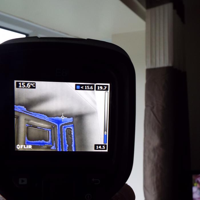 

Thermal imaging combined with atmospheric monitoring allows us to programme and establish the area&rsquo;s most at risk of condensate and mould issues when establishing the dew point temperature. Here you can see the ceiling and window reveals of this bay window which are within the region of the dew point temperature and are highlighted in the greyscale image in blue.
