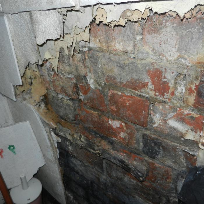 As can be clearly seen from this picture trying to cover up damp walls using timber batons and linings internally is not a sustainable repair.&nbsp;
