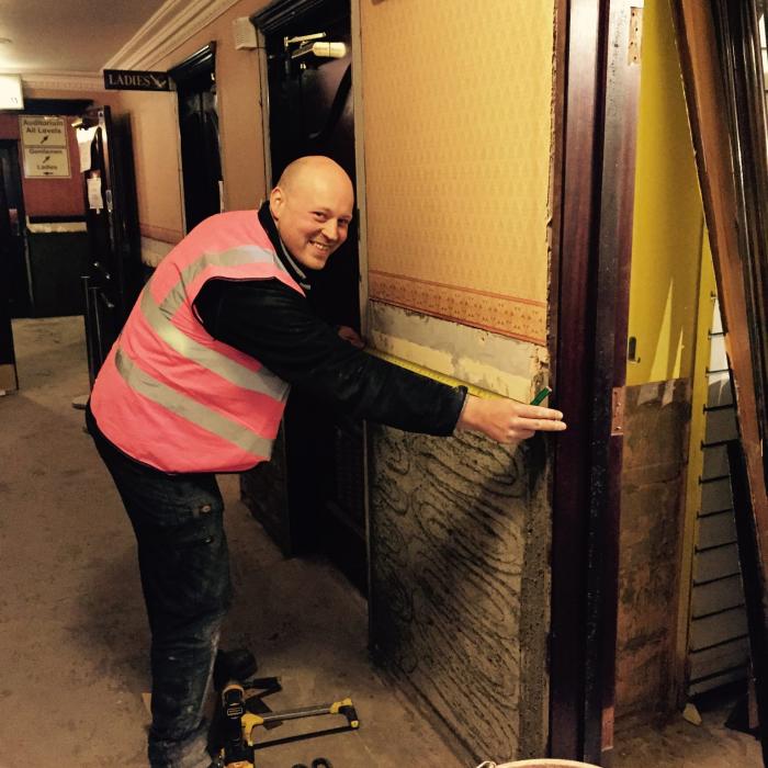 Our top joiner Matthew, measuring up woodwork during reinstatement works to &nbsp;the Grand Opera house during flood restoration following the devastating floods in January 2016.&nbsp;
